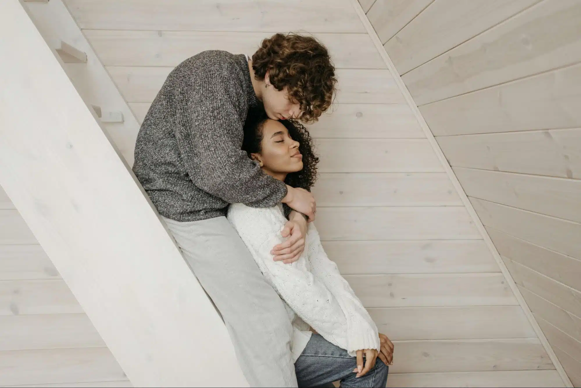 A man hugging a woman