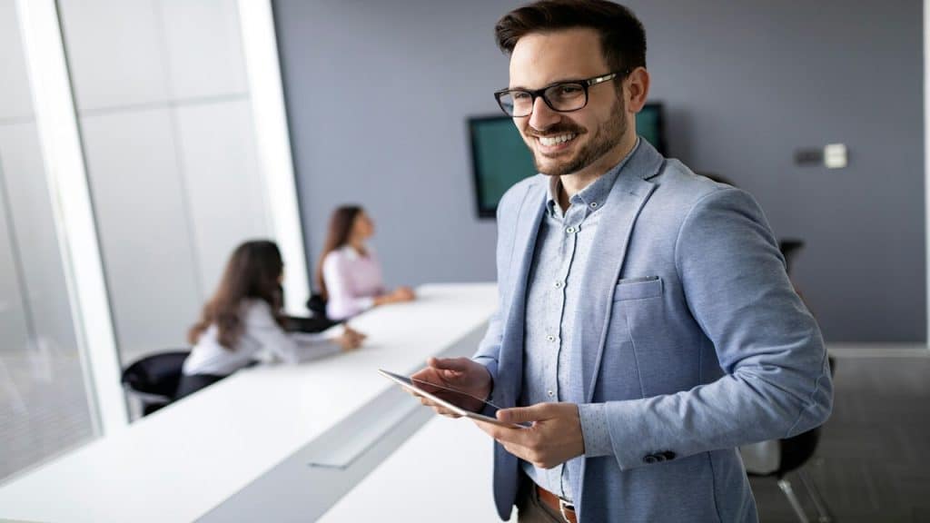 A man smiling while at work