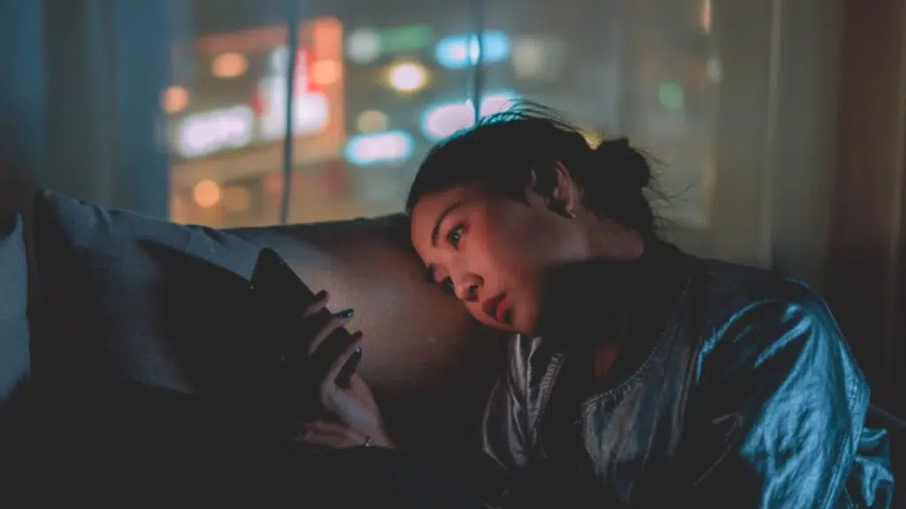 A woman waiting for a text