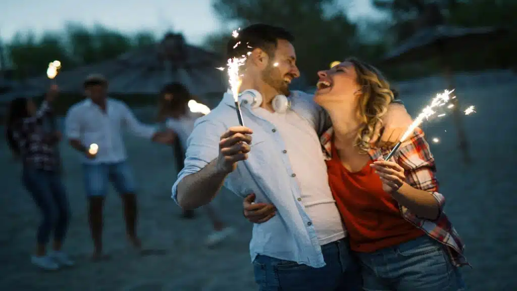 A couple laughing together at the beach