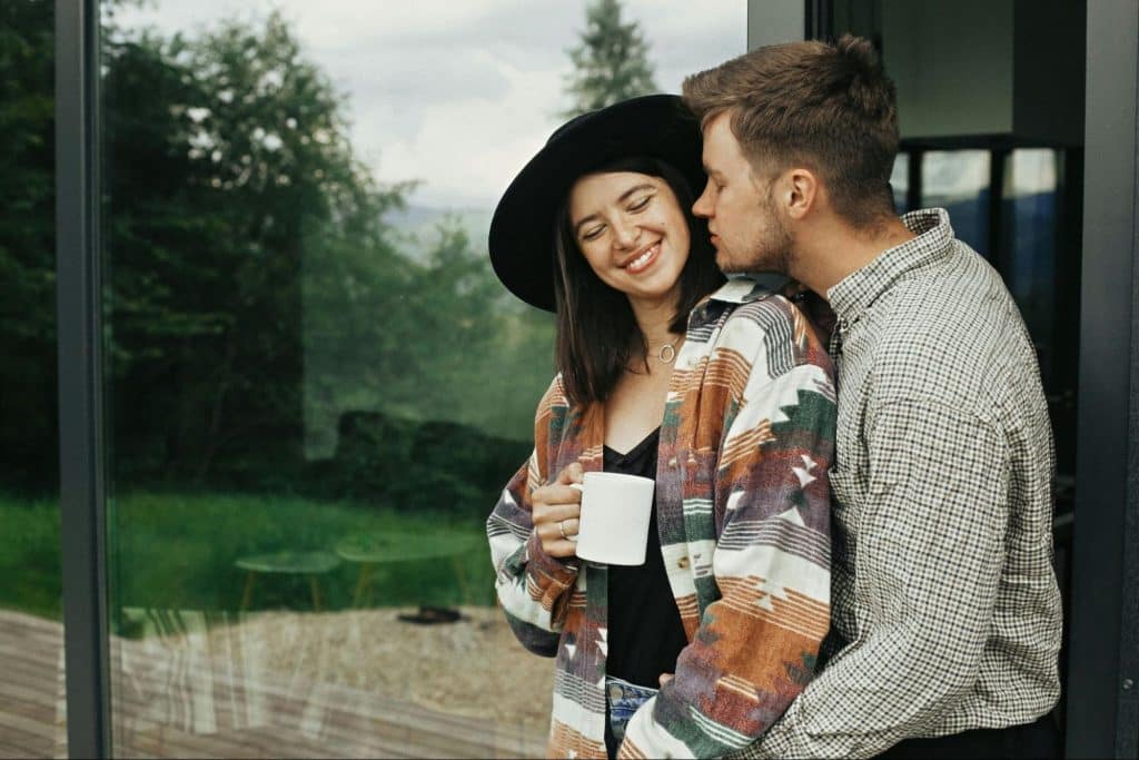 A man kissing a woman’s cheek