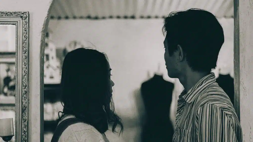 A man and a woman standing next to each other.