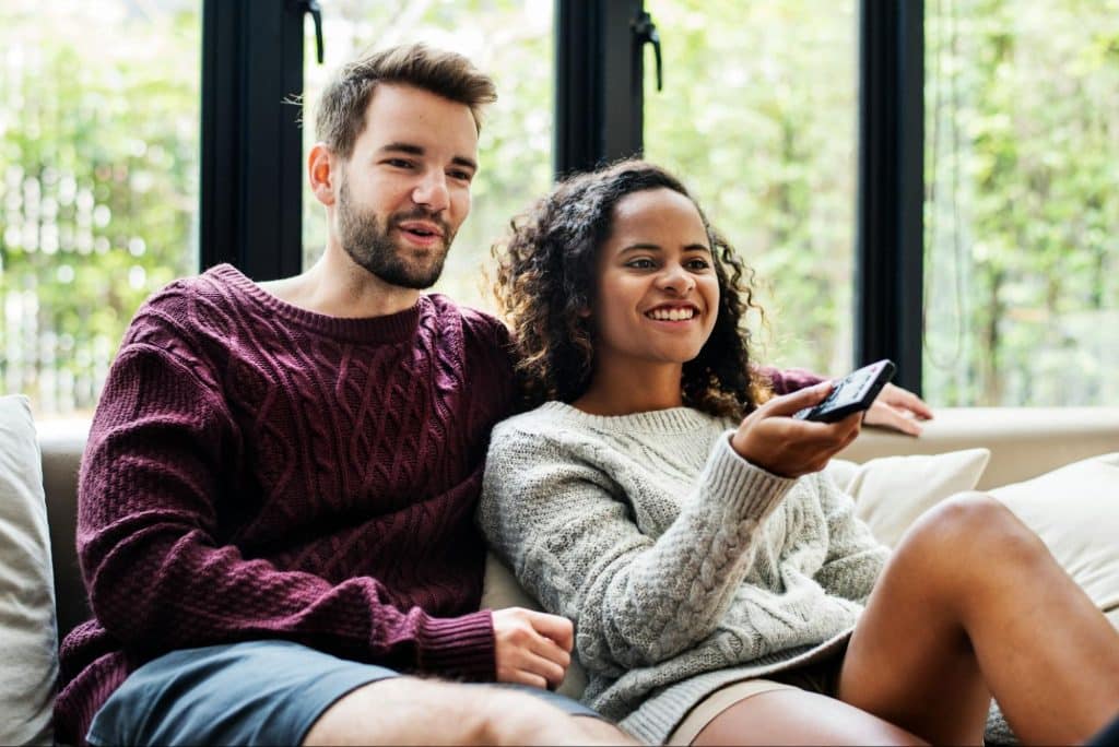 A man and woman watching a movie