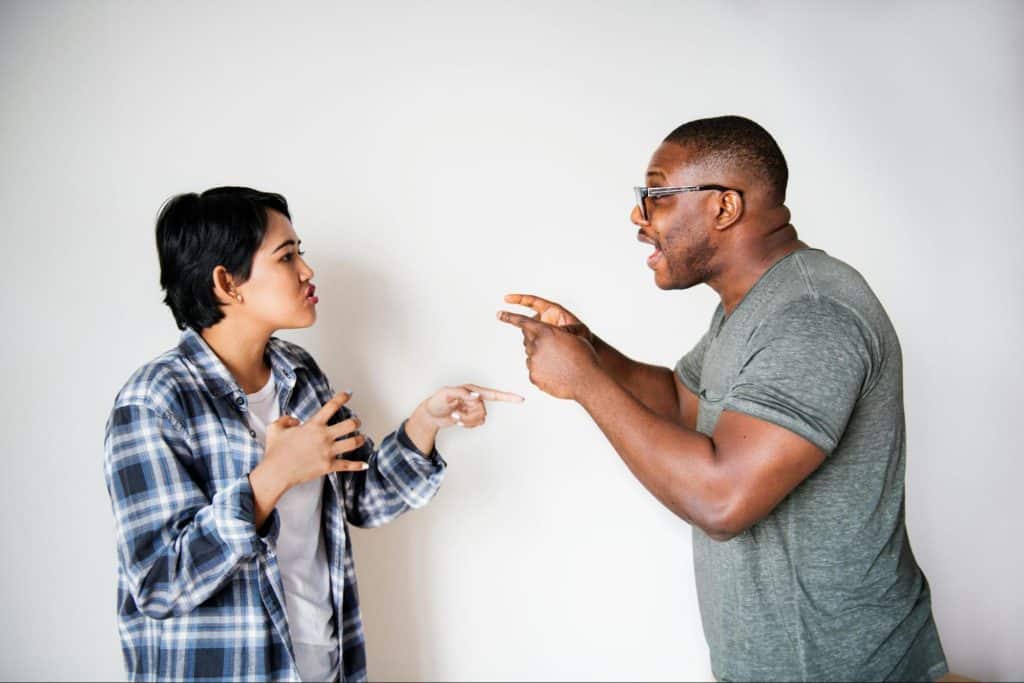 A man and woman fighting