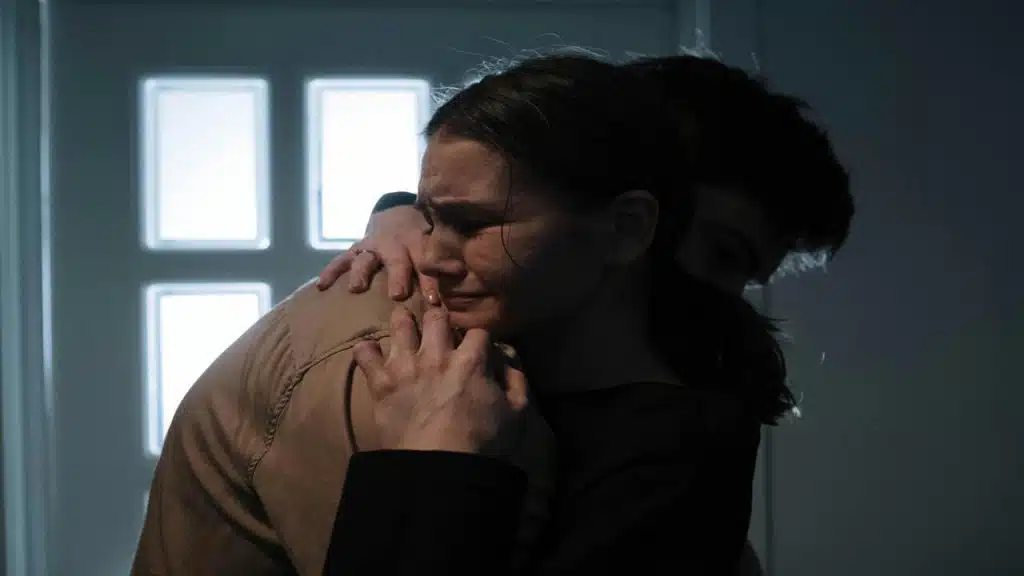 A man comforting his crying girlfriend