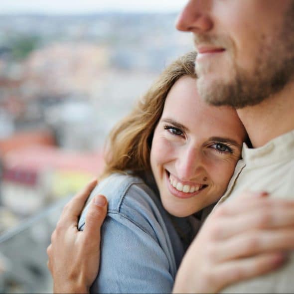 A man and woman hugging