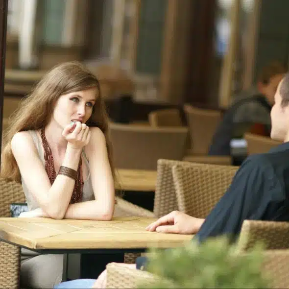 A woman listening to man