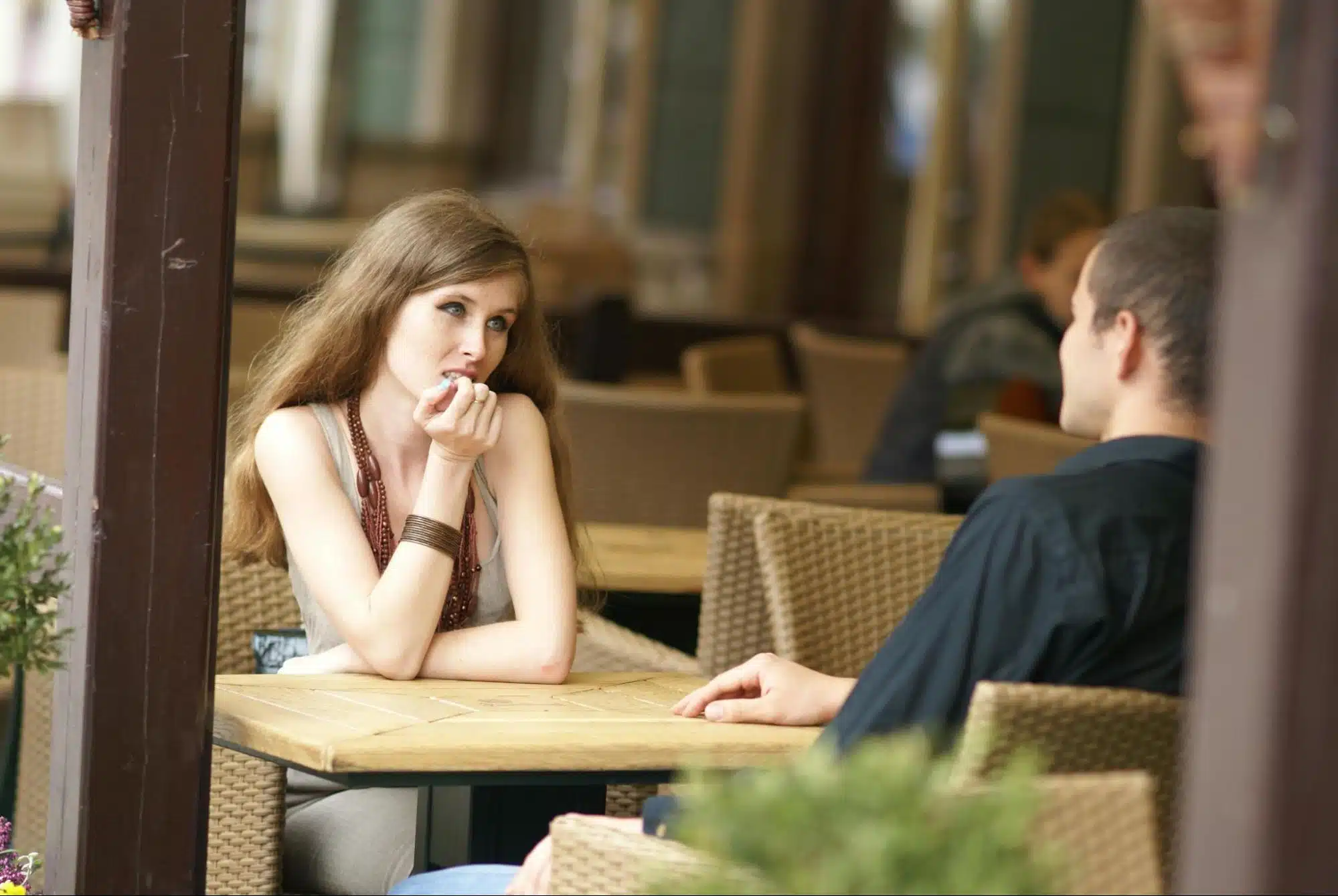 A woman listening to man