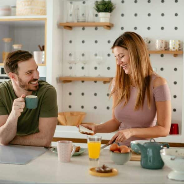 A man and woman at the kitchen