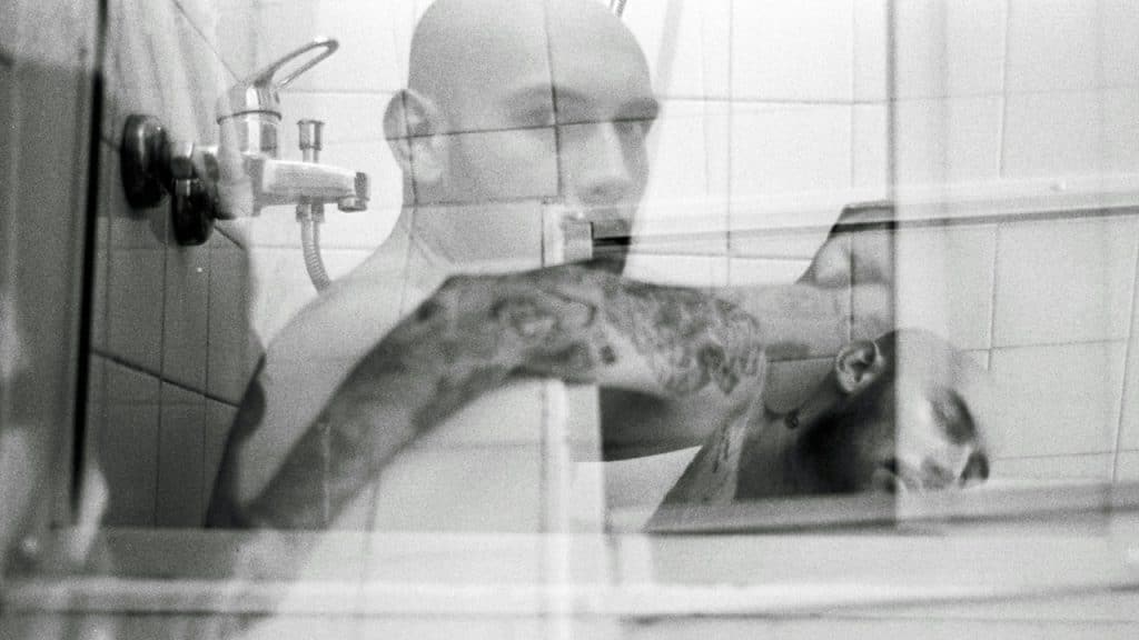 A man taking a picture of himself in a mirror.