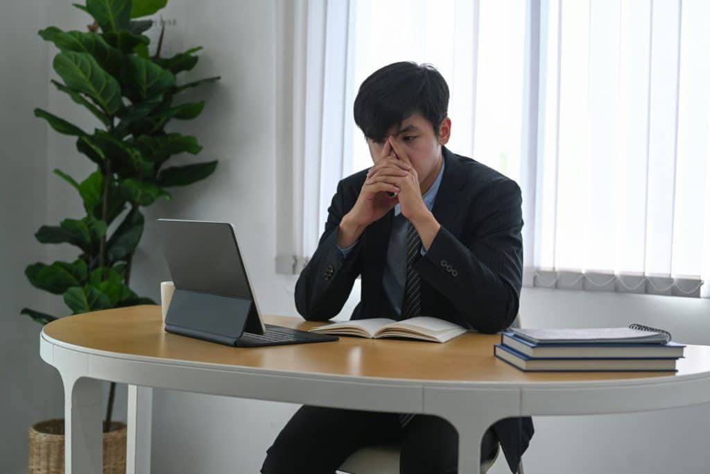 A man sitting at his desk in the office.