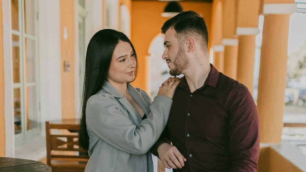 A man and a woman standing next to each other.