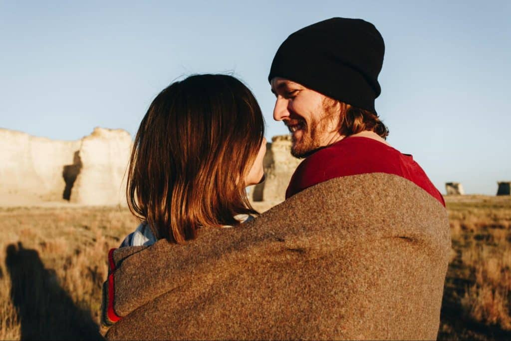 A man and woman hugging each other