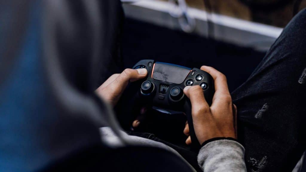 A person holding a video game controller.
