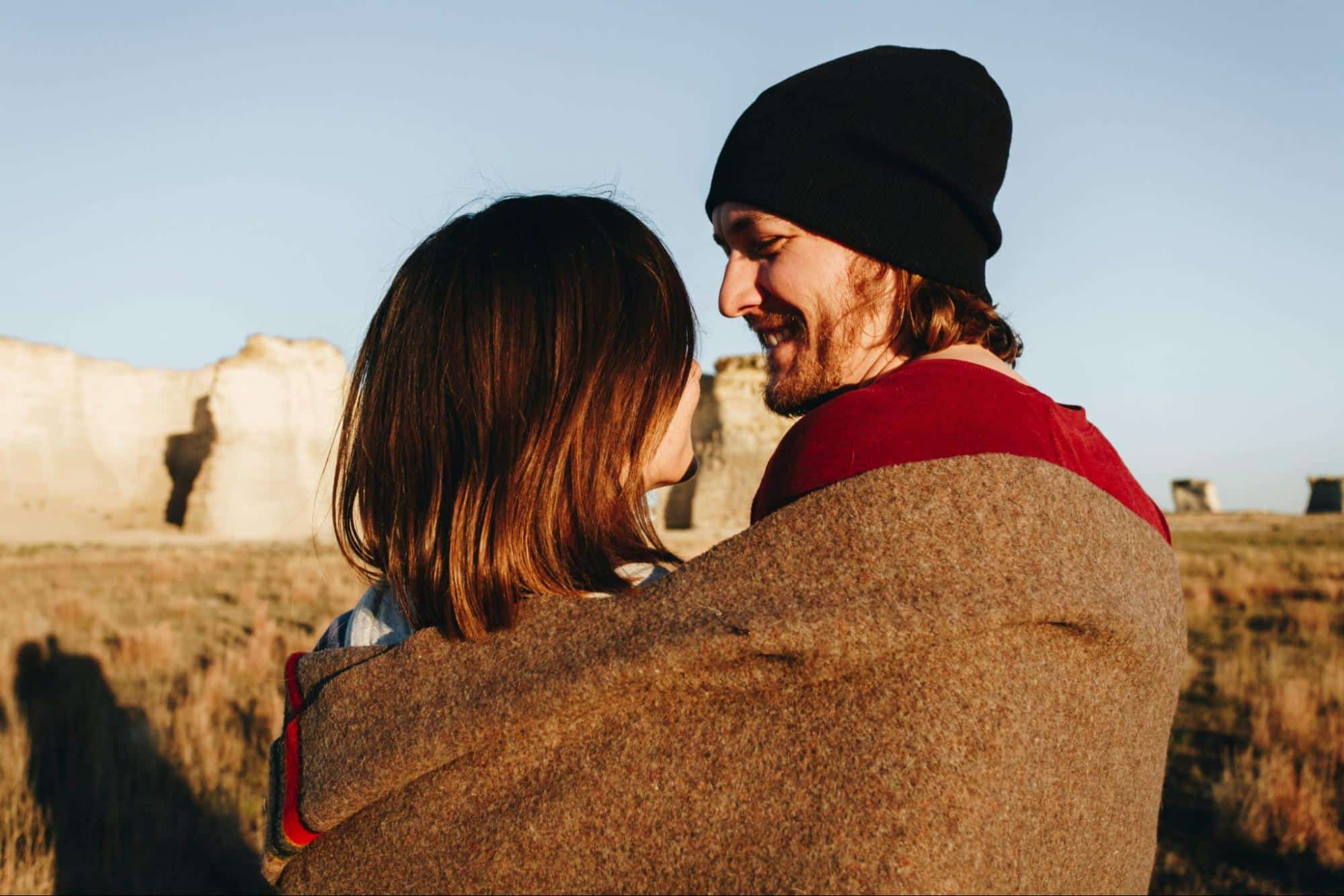 A man and woman hugging each other