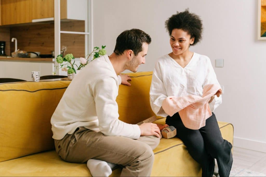 A man showing interest to woman’s work