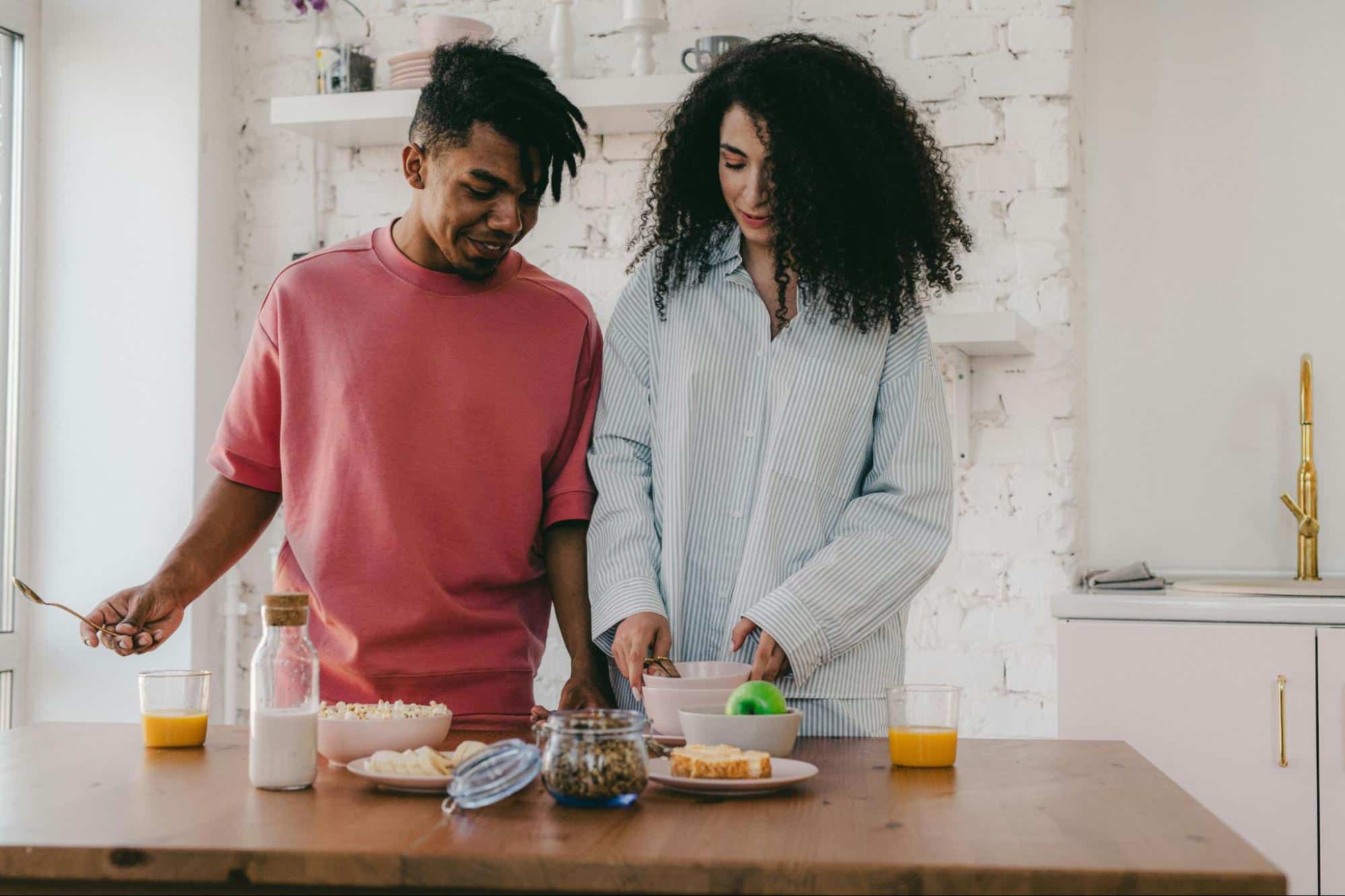 A man and woman at the kitchen