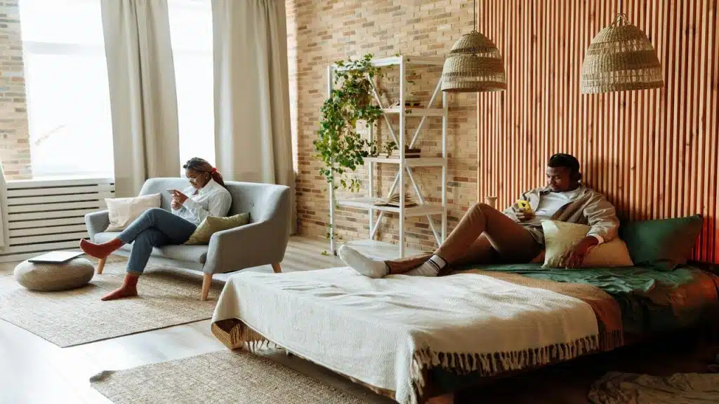 A couple doing their own thing at home