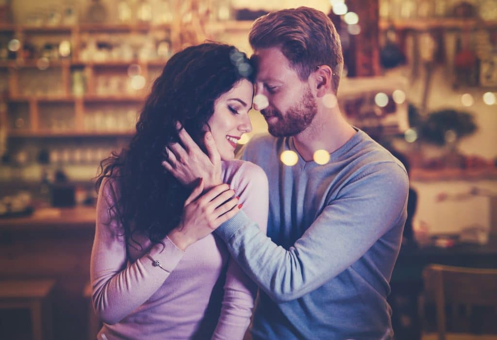 A man and a woman embracing each other.