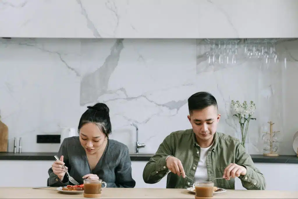 A man and woman eating