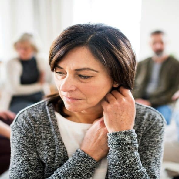 A mature woman in group therapy