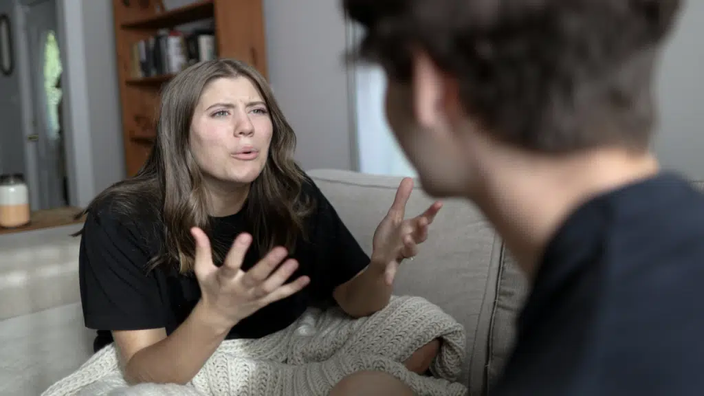 A woman confronting her husband about something 