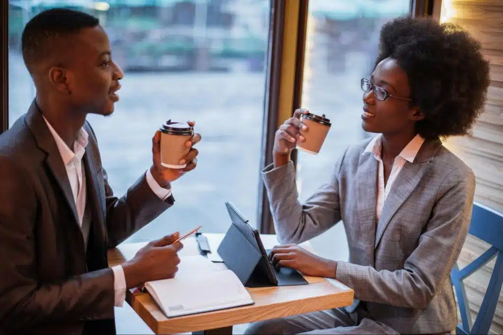 A man and woman having a cup of coffee