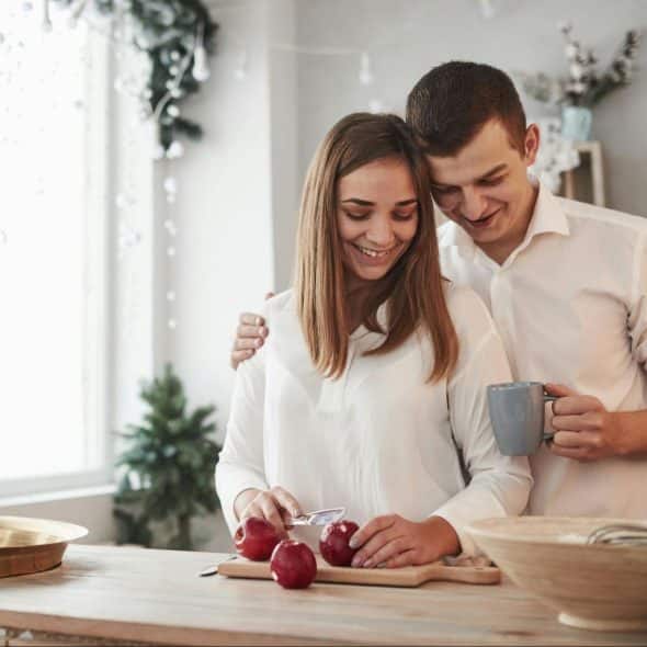 A man and woman at the kitchen