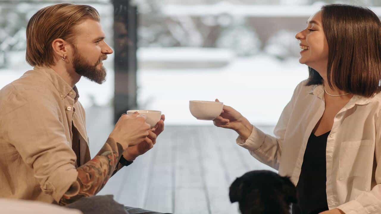A couple talking over coffee