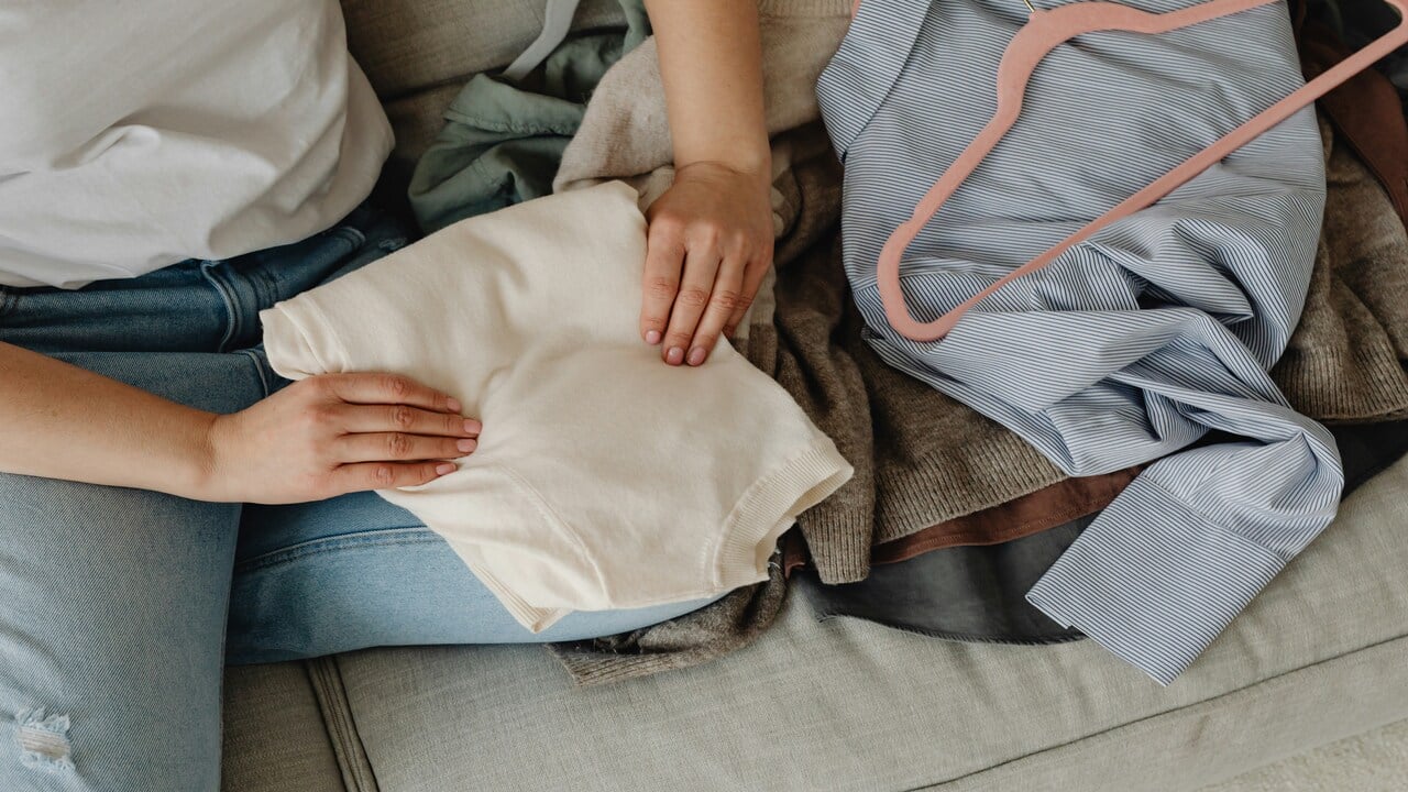 A woman folding the laundry