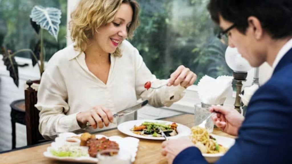 Man rejecting potential partner at a dinner table