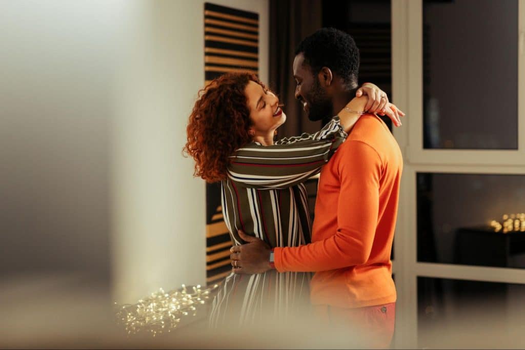 A man and woman facing each other
