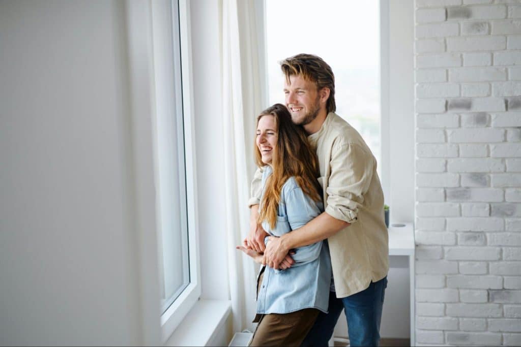A man hugging a woman