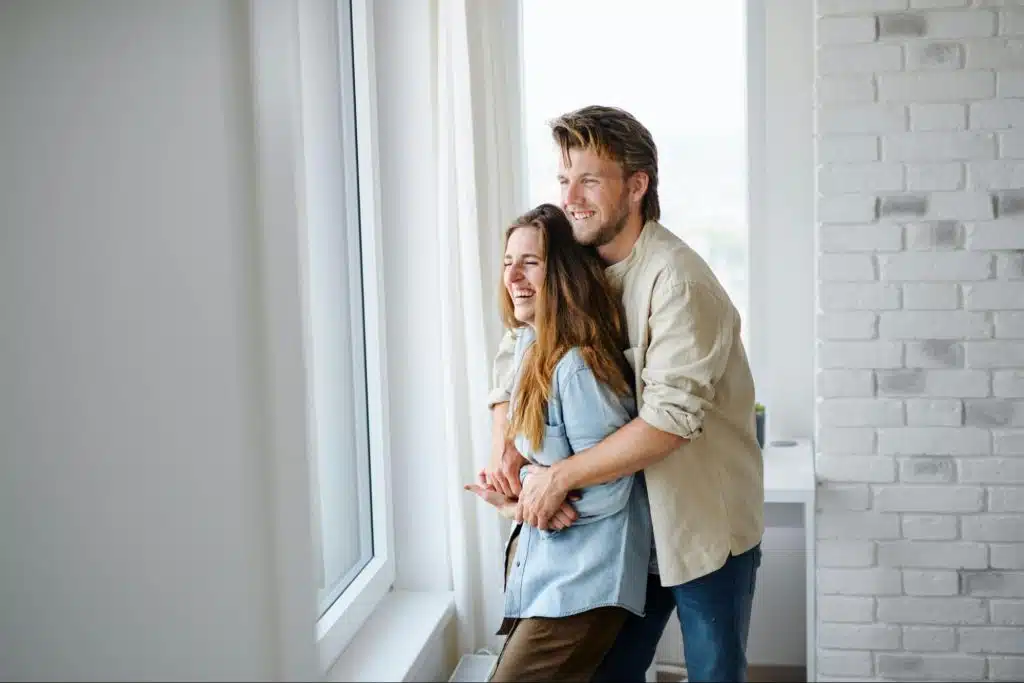 A man hugging a woman