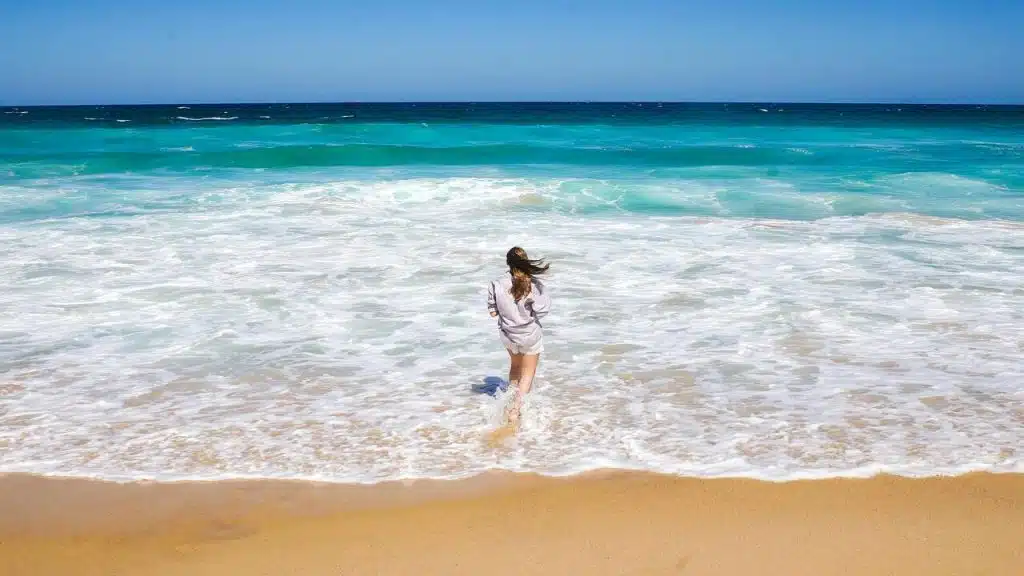 A woman standing on the shore