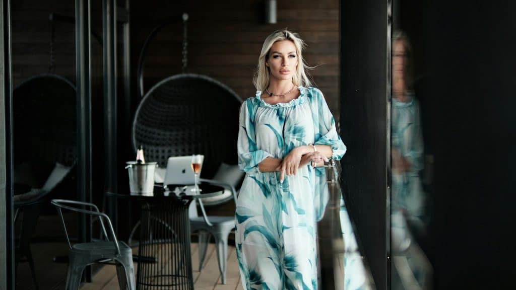 A woman sitting on a chair and looking relaxed.