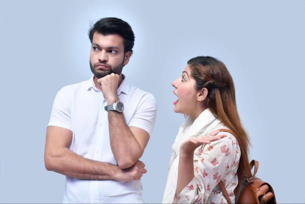 A woman telling something to man