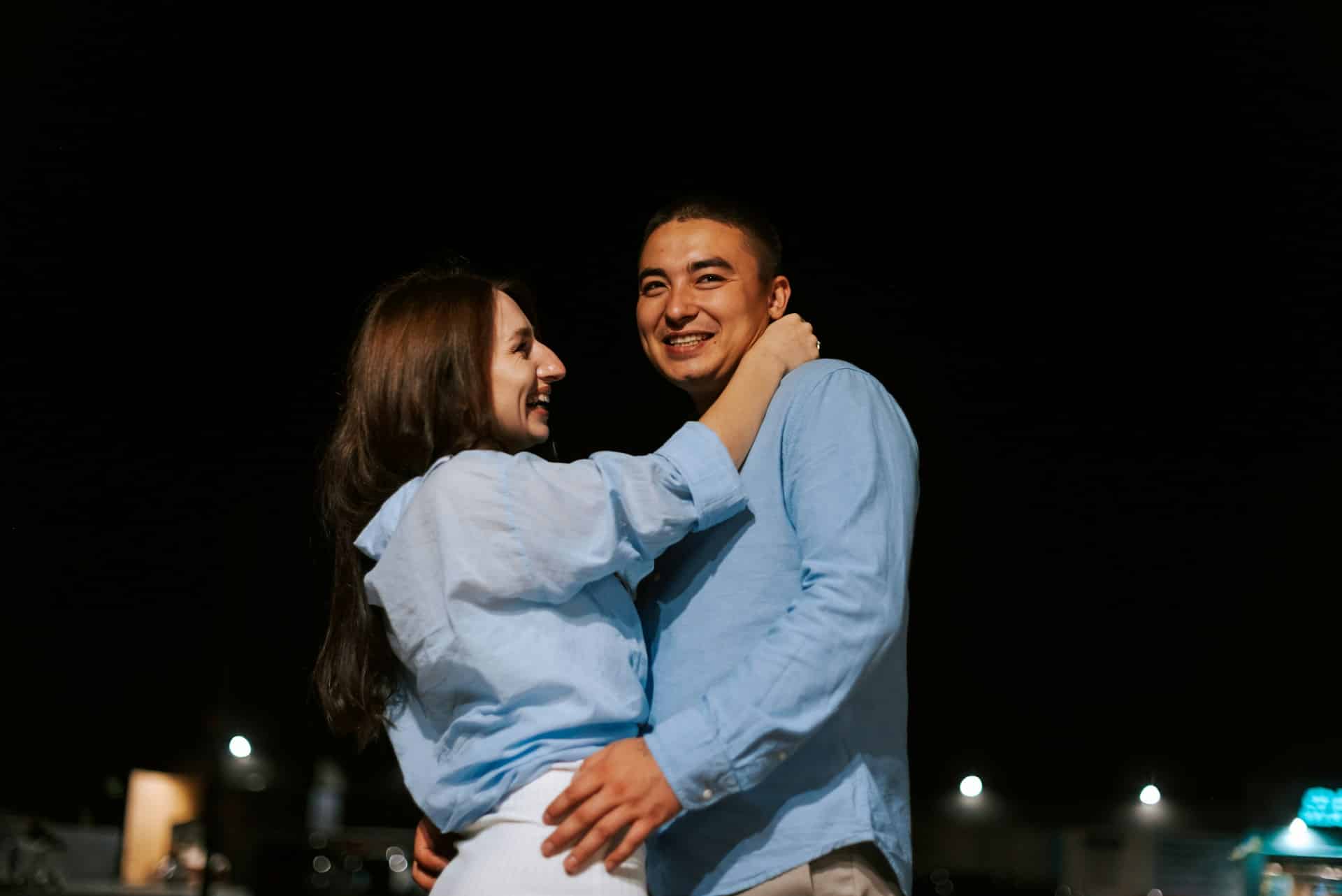A man and a woman standing next to each other.