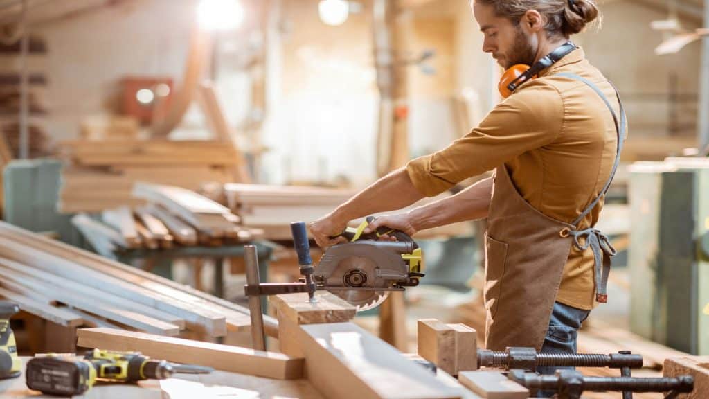 A man building furniture