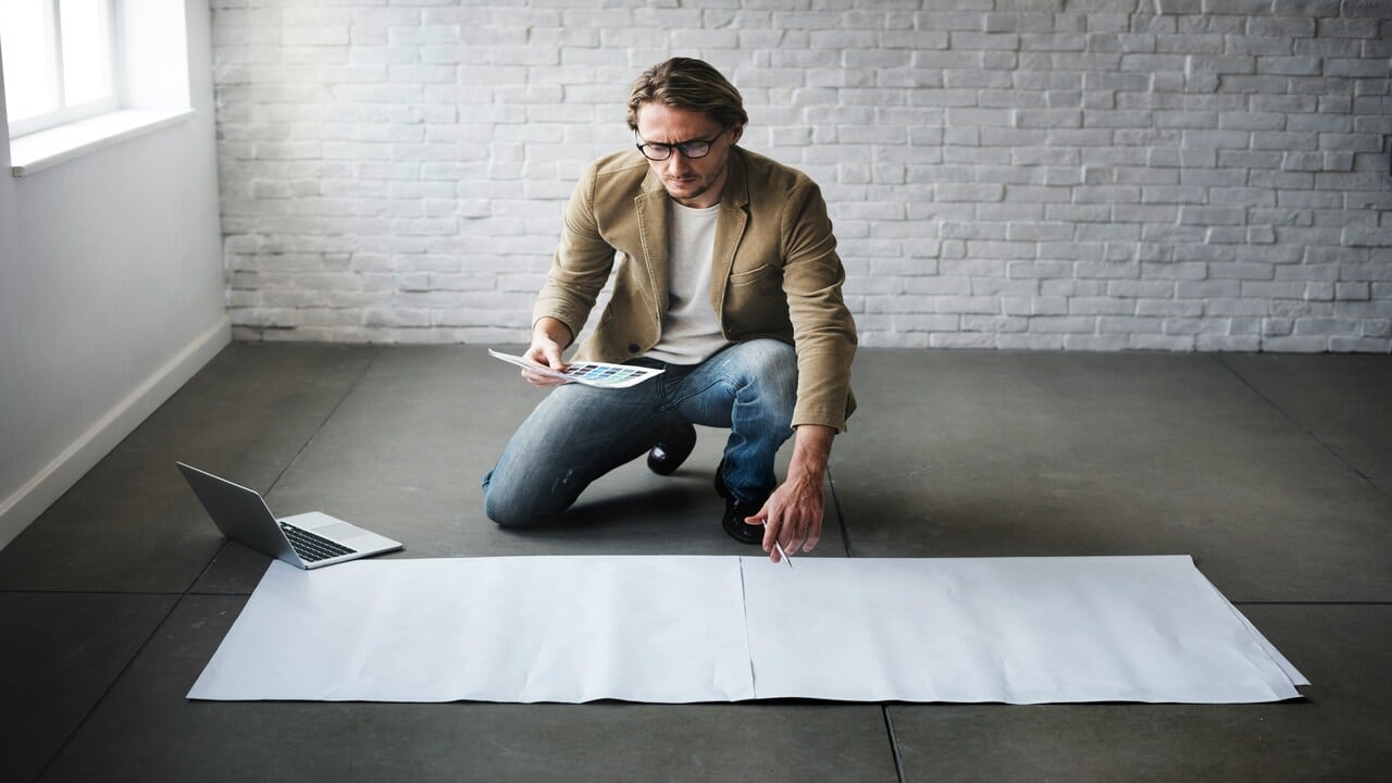 A man brainstorming for a plan