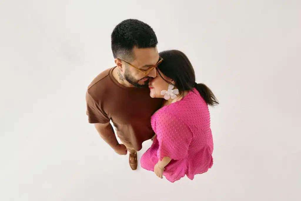 Overhead shot of a man and woman hugging.