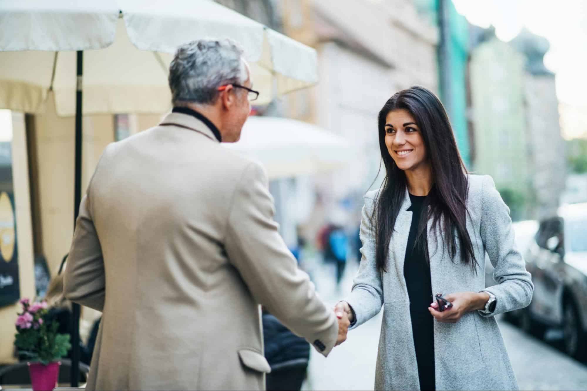 A man and woman shaking hands