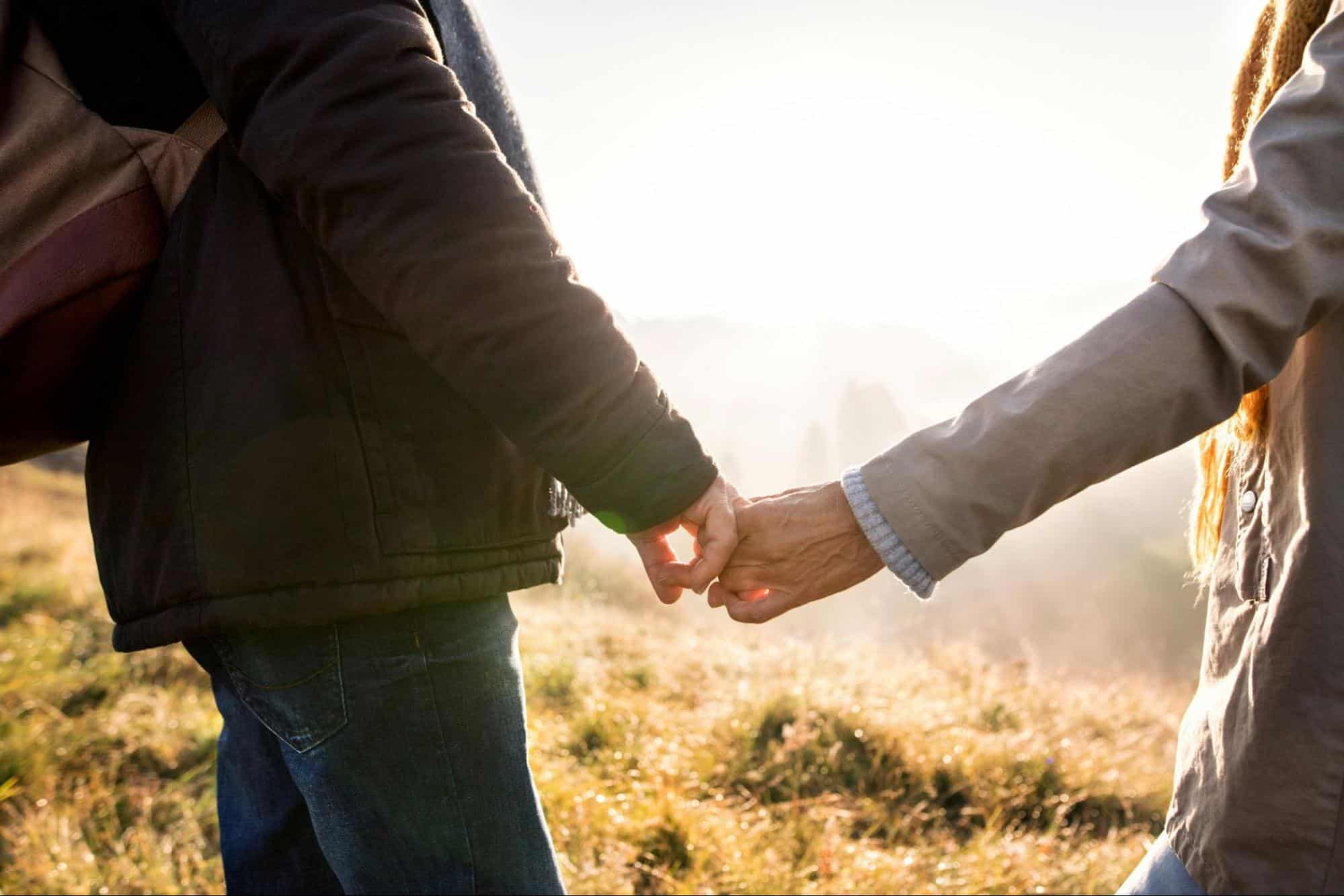 A man and woman holding hands