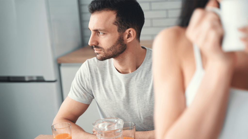A man looking thoughtful during breakfast