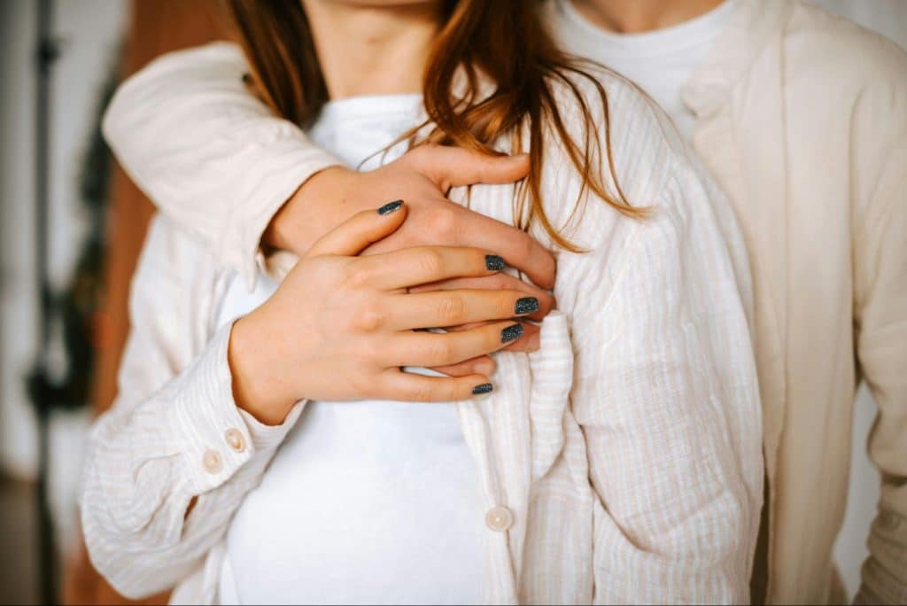 A man hugging a woman