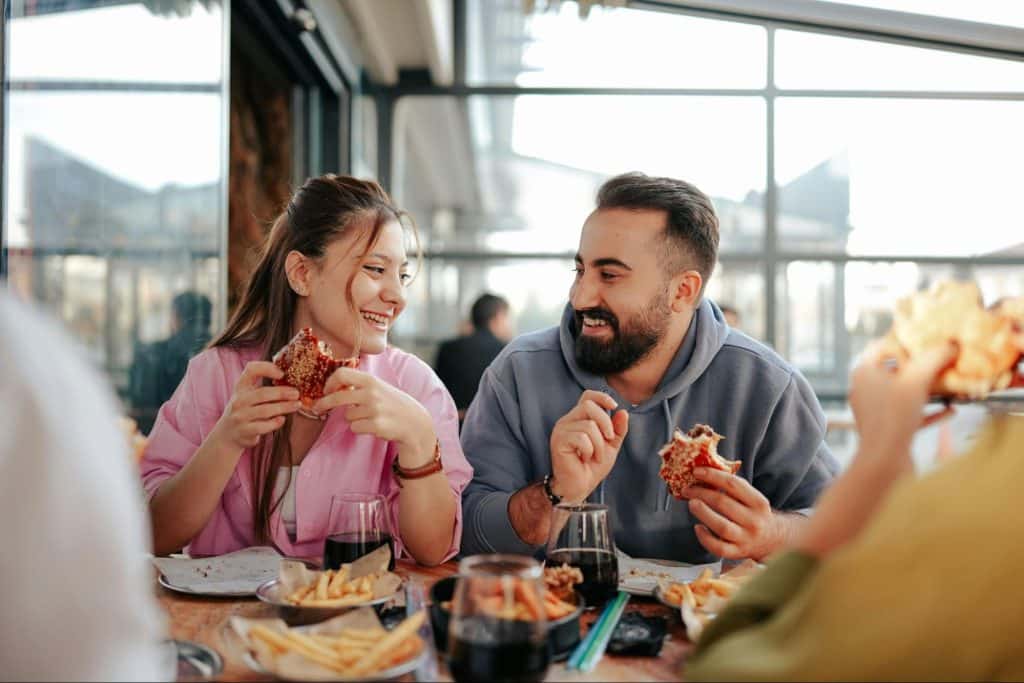 A man and woman eating together