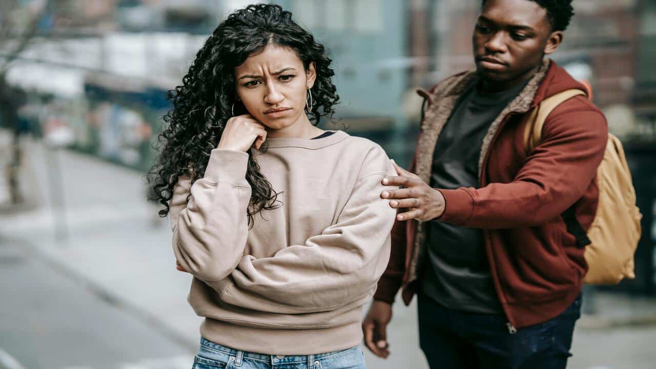A woman refusing to talk to her husband