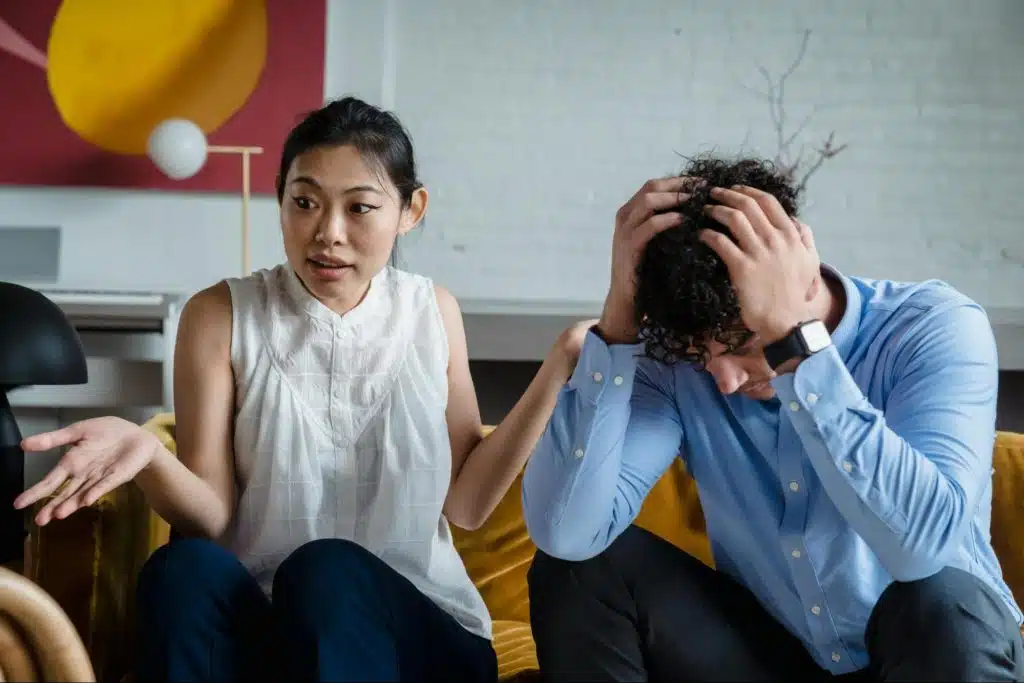 A man holding his head