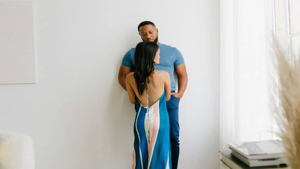 A couple looking sad in the living room
