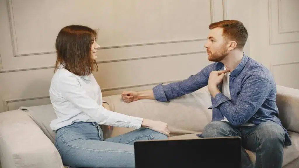A couple talking in the living room